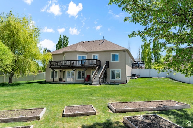 294 W Farmside Dr S, Saratoga Springs, UT 84045 - back of property with a vegetable garden, a deck, stucco siding, and stairs