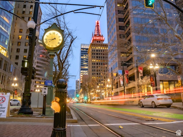 view of street with street lighting, a city view, and sidewalks