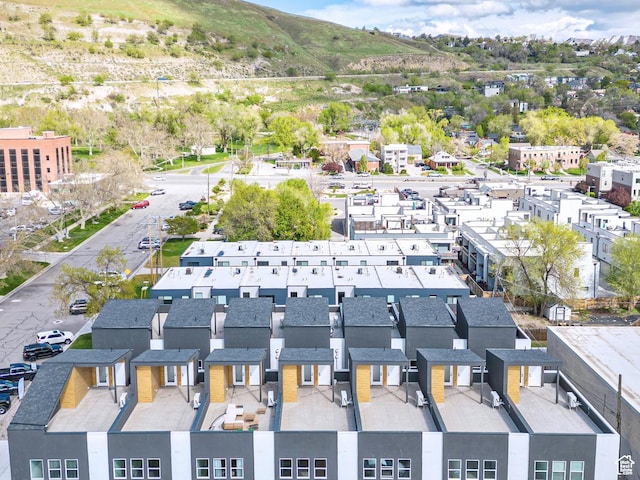 drone / aerial view featuring a residential view and a mountain view