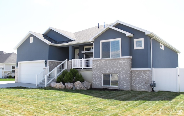 2447 N 2950 W, Plain City, UT 84404 - back of house featuring brick siding, driveway, a porch, stucco siding, and an attached garage