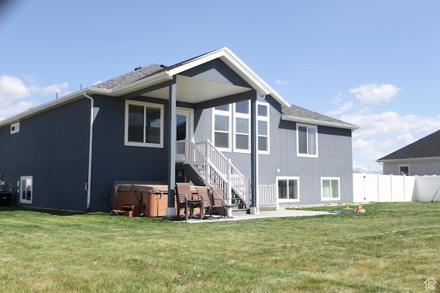 2447 N 2950 W, Plain City, UT 84404 - rear view of property featuring a hot tub and a patio