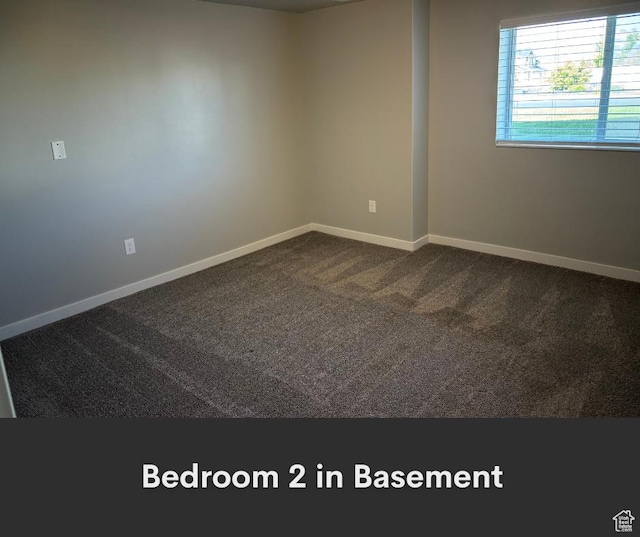2447 N 2950 W, Plain City, UT 84404 - spare room featuring baseboards and dark colored carpet