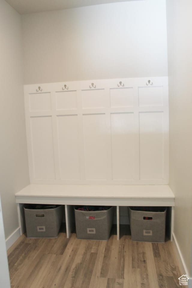 2447 N 2950 W, Plain City, UT 84404 - mudroom with light wood-style flooring, baseboards, and built in desk