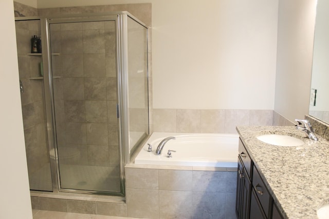 2447 N 2950 W, Plain City, UT 84404 - bathroom featuring vanity, a stall shower, and a garden tub
