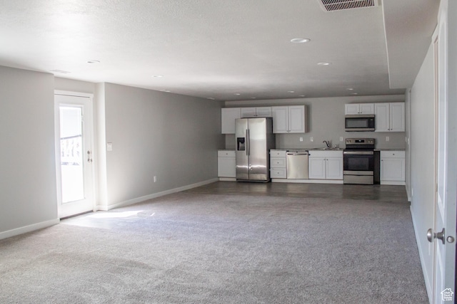 2447 N 2950 W, Plain City, UT 84404 - unfurnished living room featuring carpet flooring, baseboards, and recessed lighting