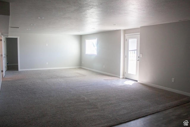 2447 N 2950 W, Plain City, UT 84404 - carpeted spare room featuring a textured ceiling and baseboards