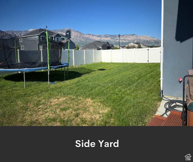 2447 N 2950 W, Plain City, UT 84404 - view of yard with a trampoline and a mountain view