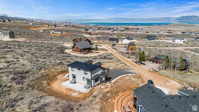 3467 S Porcupine Cir, Garden City, UT 84028 - drone / aerial view with a water and mountain view