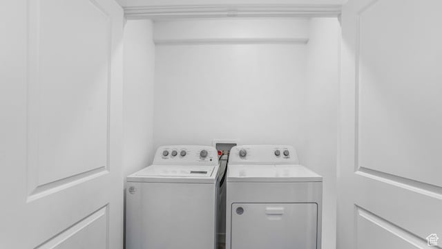 laundry area with separate washer and dryer and laundry area