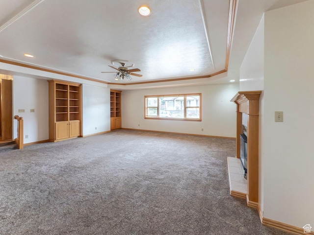 unfurnished living room with ceiling fan, a tiled fireplace, carpet floors, baseboards, and recessed lighting