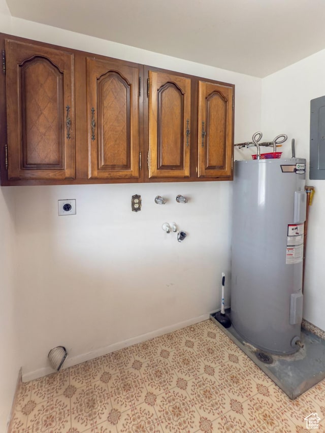 laundry area with cabinet space, hookup for a washing machine, electric dryer hookup, baseboards, and electric water heater