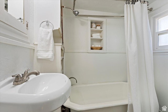 555 15th St, Ogden, UT 84404 - bathroom with a sink and shower / bathtub combination with curtain