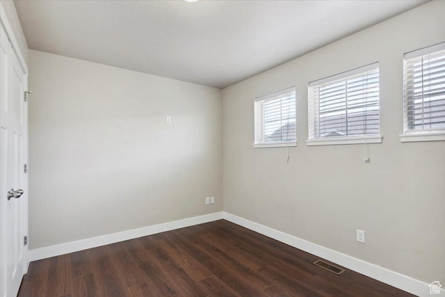 1545 N 420 W Unit 103, Logan, UT 84341 - unfurnished room with dark wood-style flooring and baseboards