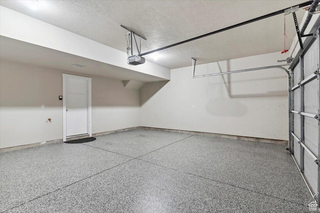 1545 N 420 W Unit 103, Logan, UT 84341 - garage featuring a garage door opener and baseboards