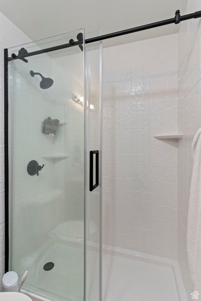 1545 N 420 W Unit 103, Logan, UT 84341 - bathroom featuring a shower stall and toilet