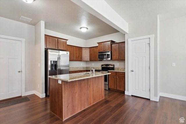 1545 N 420 W Unit 103, Logan, UT 84341 - kitchen featuring appliances with stainless steel finishes, a sink, dark wood finished floors, and baseboards