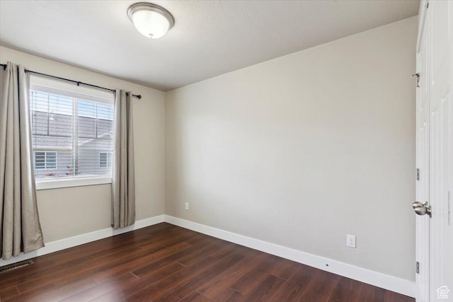 1545 N 420 W Unit 103, Logan, UT 84341 - spare room with dark wood-style floors and baseboards