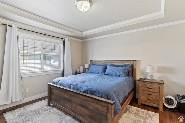 1545 N 420 W Unit 103, Logan, UT 84341 - bedroom with crown molding, visible vents, wood finished floors, baseboards, and a tray ceiling