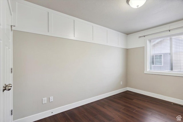 1545 N 420 W Unit 103, Logan, UT 84341 - spare room with dark wood-type flooring and baseboards
