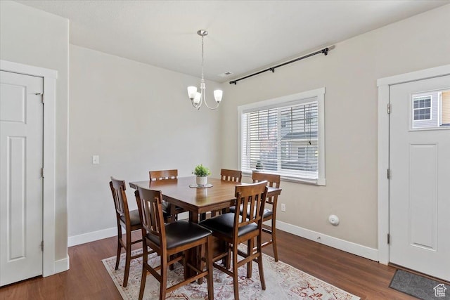 1545 N 420 W Unit 103, Logan, UT 84341 - dining room with baseboards, wood finished floors, and a notable chandelier