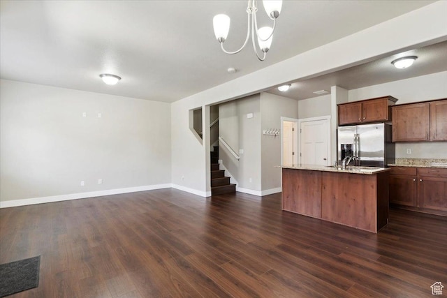 1545 N 420 W Unit 103, Logan, UT 84341 - kitchen with stainless steel fridge with ice dispenser, dark wood-style floors, a chandelier, an island with sink, and baseboards