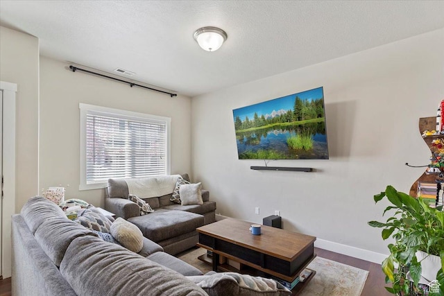 1545 N 420 W Unit 103, Logan, UT 84341 - living room featuring baseboards, dark wood finished floors, and visible vents