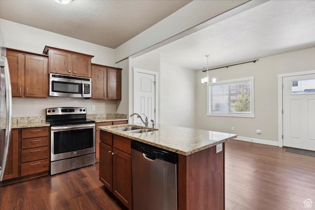 1545 N 420 W Unit 103, Logan, UT 84341 - kitchen featuring stainless steel appliances, a sink, dark wood-style floors, a chandelier, and light stone countertops