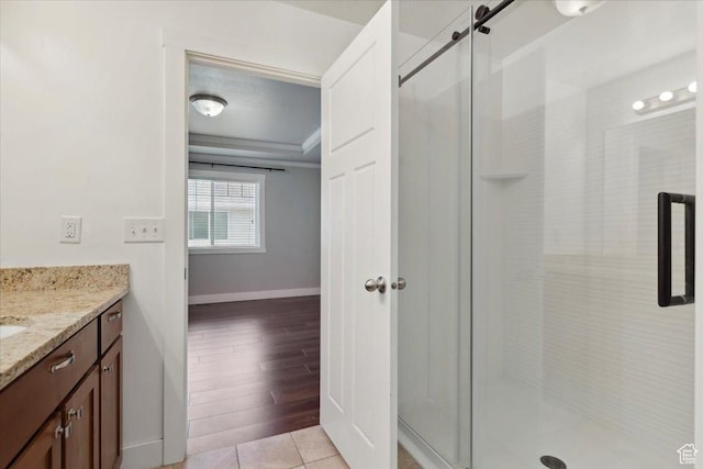 1545 N 420 W Unit 103, Logan, UT 84341 - full bath with vanity, a shower stall, baseboards, and crown molding