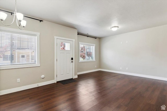 1545 N 420 W Unit 103, Logan, UT 84341 - foyer entrance featuring a chandelier, dark wood finished floors, and baseboards