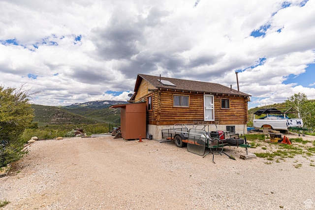 2185 Crestridge Rd Unit 51, Salina, UT 84654 - view of side of property featuring roof with shingles, a mountain view, and log exterior