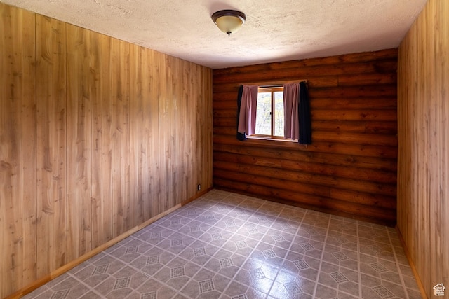 2185 Crestridge Rd Unit 51, Salina, UT 84654 - spare room featuring rustic walls and a textured ceiling