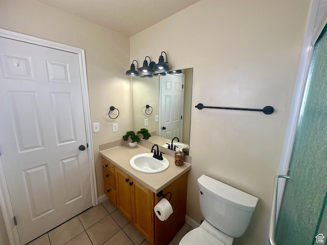 819 E 725 N, Ogden, UT 84404 - bathroom featuring tile patterned flooring, toilet, and vanity