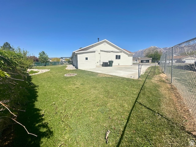 819 E 725 N, Ogden, UT 84404 - view of yard featuring a fenced backyard, a patio area, a fire pit, and cooling unit