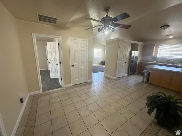 819 E 725 N, Ogden, UT 84404 - kitchen featuring light tile patterned flooring, ceiling fan, stainless steel fridge with ice dispenser, baseboards, and visible vents