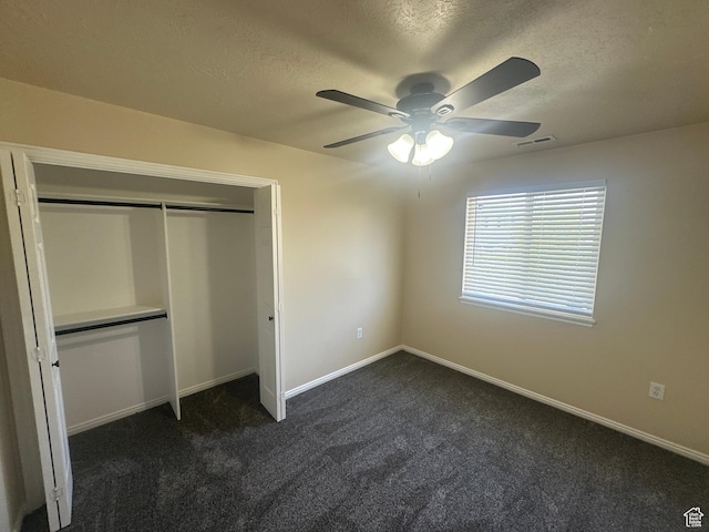 819 E 725 N, Ogden, UT 84404 - unfurnished bedroom featuring visible vents, a closet, dark carpet, baseboards, and a textured ceiling