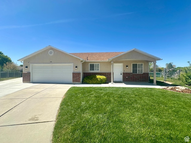 819 E 725 N, Ogden, UT 84404 - single story home with fence, a garage, a front lawn, and brick siding