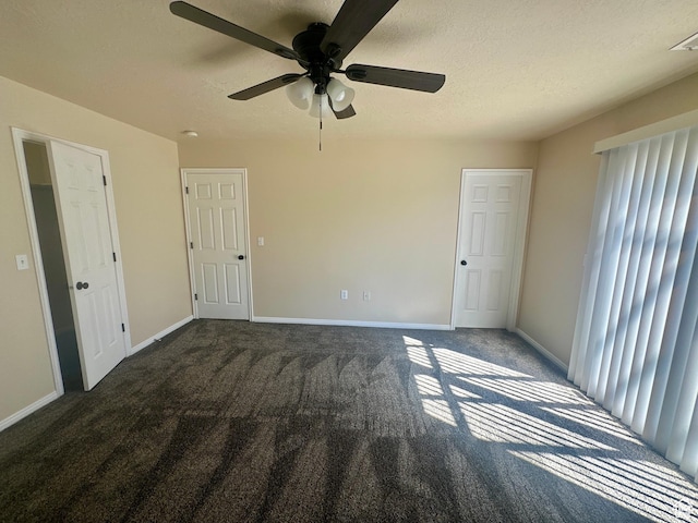 819 E 725 N, Ogden, UT 84404 - unfurnished bedroom with a textured ceiling, baseboards, ceiling fan, and carpet