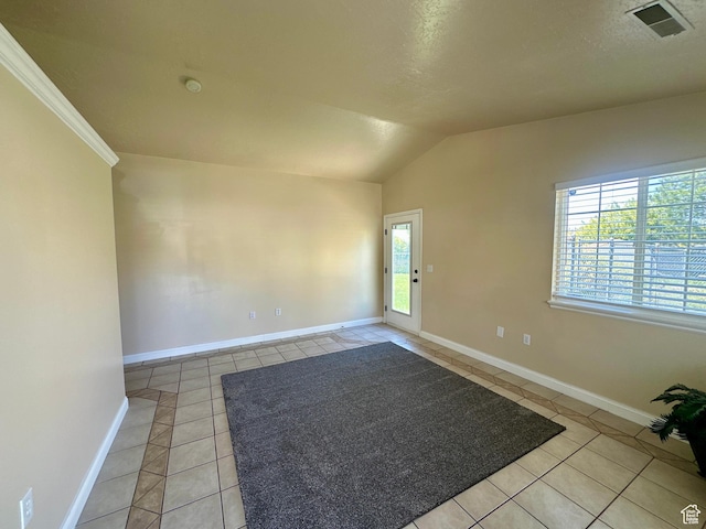 819 E 725 N, Ogden, UT 84404 - unfurnished room with baseboards, visible vents, light tile patterned floors, and lofted ceiling