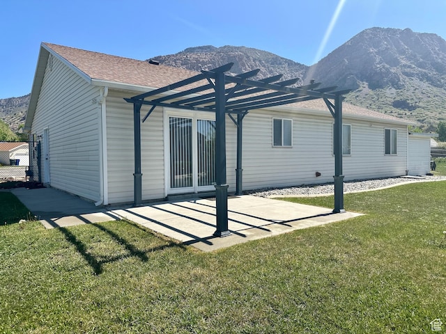 819 E 725 N, Ogden, UT 84404 - rear view of house featuring a lawn, a pergola, a shingled roof, and a mountain view