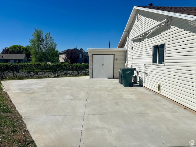 819 E 725 N, Ogden, UT 84404 - view of patio / terrace with a storage unit and an outdoor structure