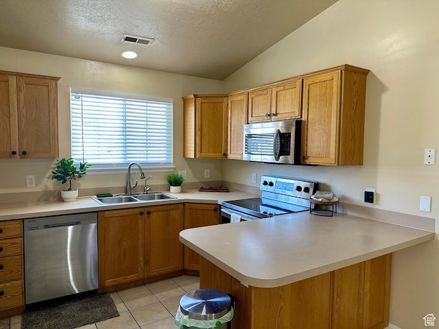 819 E 725 N, Ogden, UT 84404 - kitchen featuring visible vents, a peninsula, light countertops, a sink, and appliances with stainless steel finishes