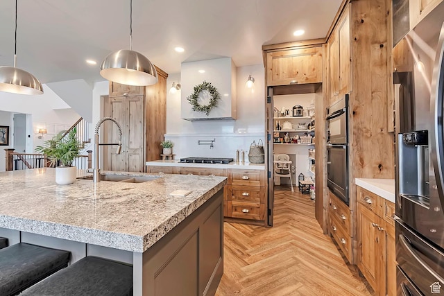 6433 N Glenmar Way, Eagle Mountain, UT 84005 - kitchen featuring brown cabinetry, gas stovetop, a sink, stainless steel fridge with ice dispenser, and a breakfast bar