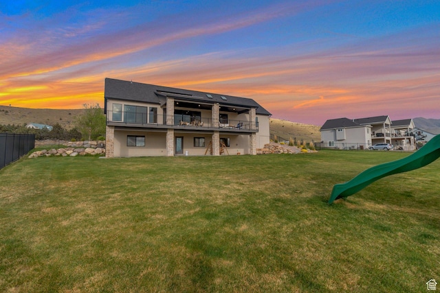 6433 N Glenmar Way, Eagle Mountain, UT 84005 - rear view of house with fence and a yard
