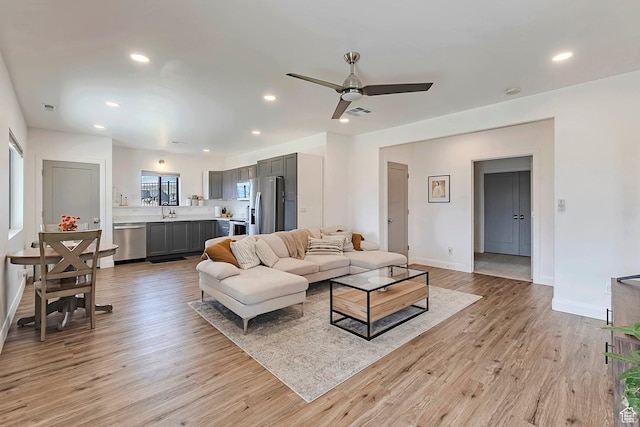 6433 N Glenmar Way, Eagle Mountain, UT 84005 - living area with visible vents, baseboards, ceiling fan, recessed lighting, and light wood finished floors