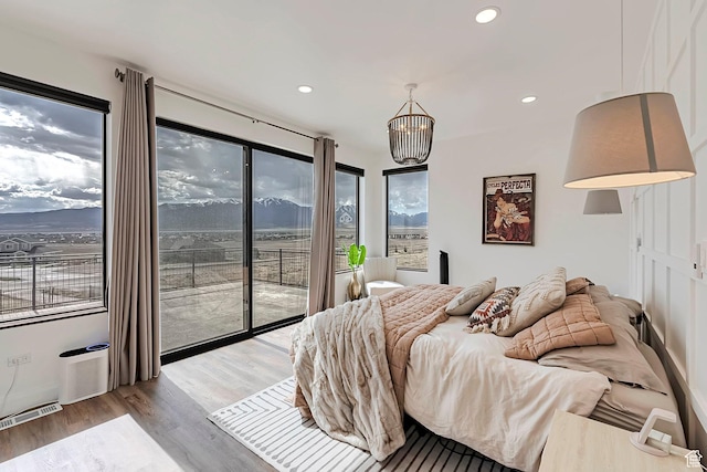 6433 N Glenmar Way, Eagle Mountain, UT 84005 - bedroom with access to outside, recessed lighting, wood finished floors, and visible vents