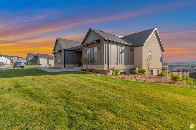 6433 N Glenmar Way, Eagle Mountain, UT 84005 - view of side of home with a yard, fence, a shingled roof, and cooling unit