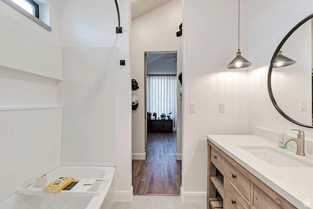 6433 N Glenmar Way, Eagle Mountain, UT 84005 - full bathroom featuring vanity, connected bathroom, baseboards, and wood finished floors