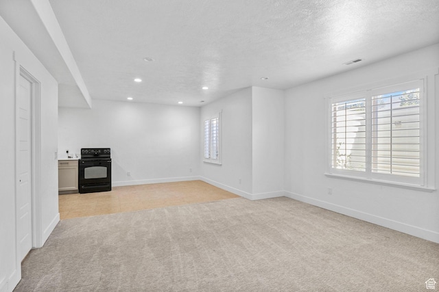 interior space with baseboards, visible vents, recessed lighting, and light colored carpet