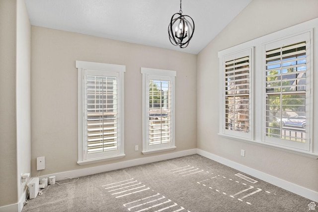 unfurnished dining area with baseboards, a notable chandelier, carpet floors, and visible vents