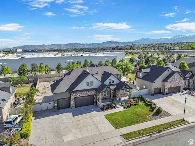 drone / aerial view with a mountain view and a residential view